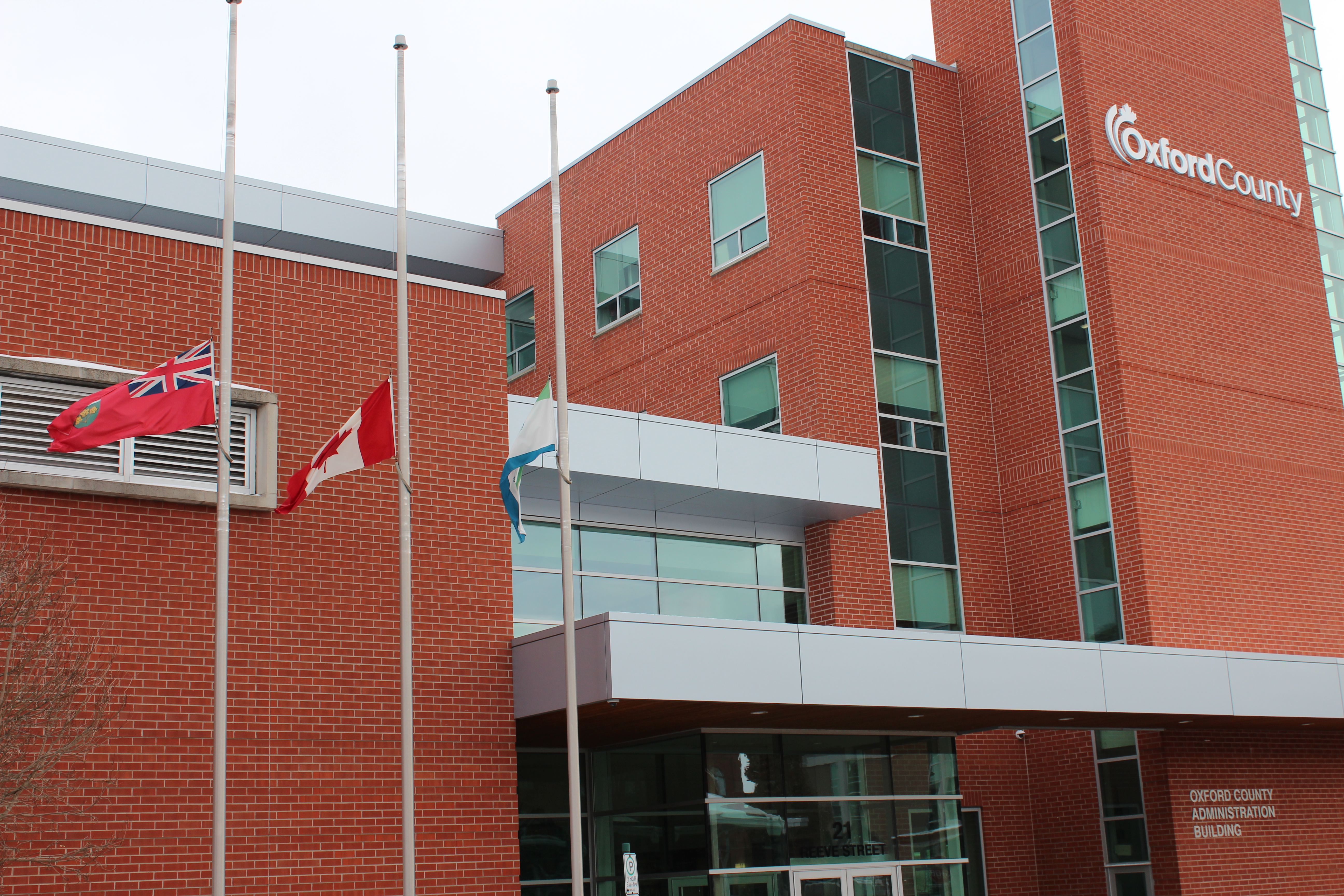 National Day of Remembrance and Action on Violence Against Women flags at half mast